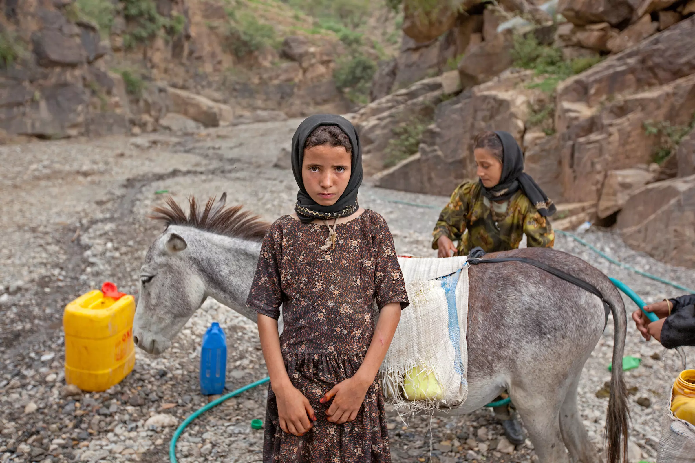 Tehani, 8, works in the fields just outside her village in the rural areas of Hajjah, Yemen.