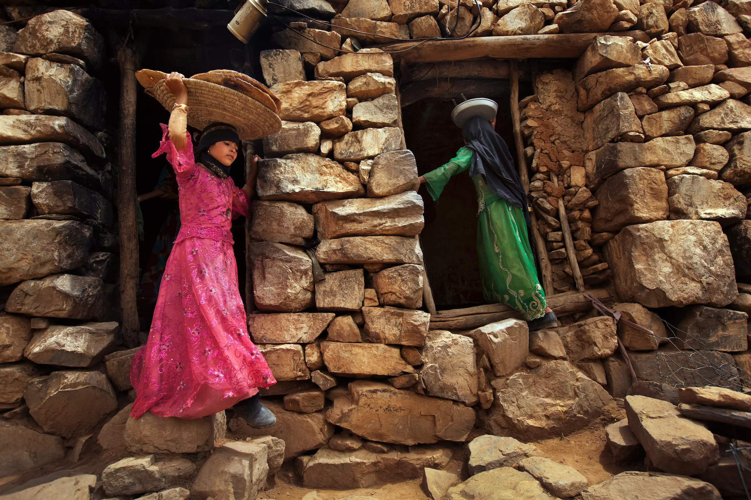 Eight-year- old brides Tehani and Ghada begin preparations for a family meal