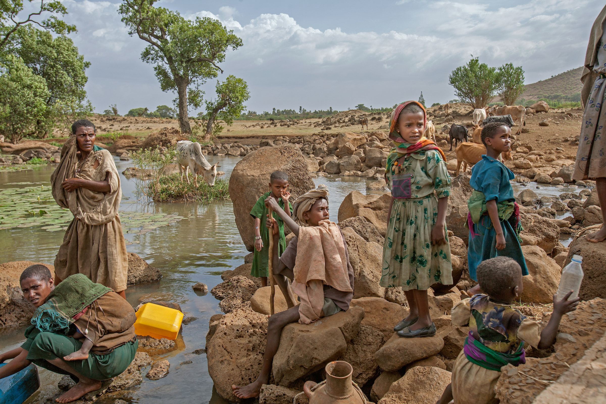 A family gathers water from a stream outside of Bahir Dar, Ethiopia.